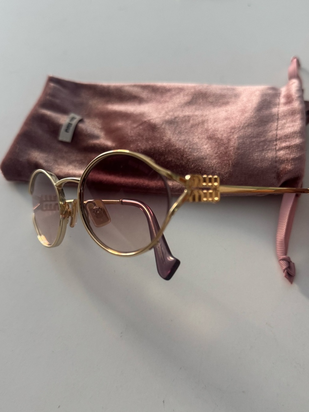 Miu Miu Gold Frame Sunglasses with Purple Lenses